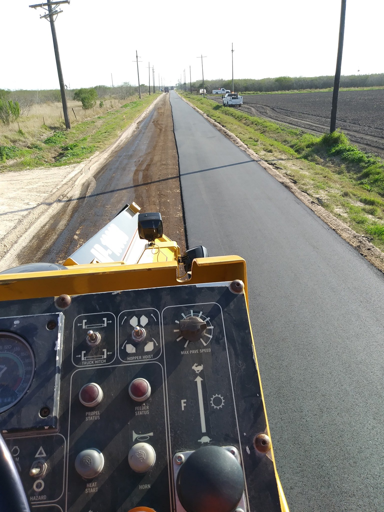 Diamond Eight paver operator view — fresh asphalt road, South Texas